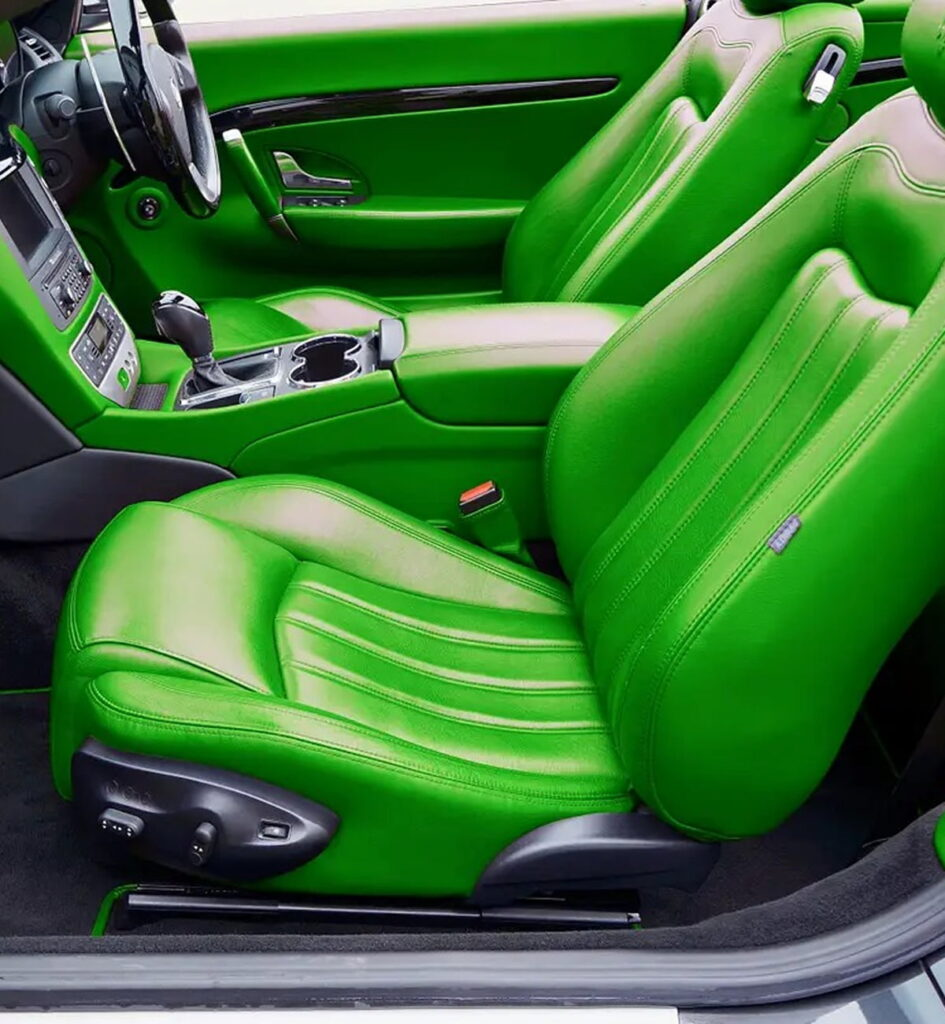 The green upholstery of a car