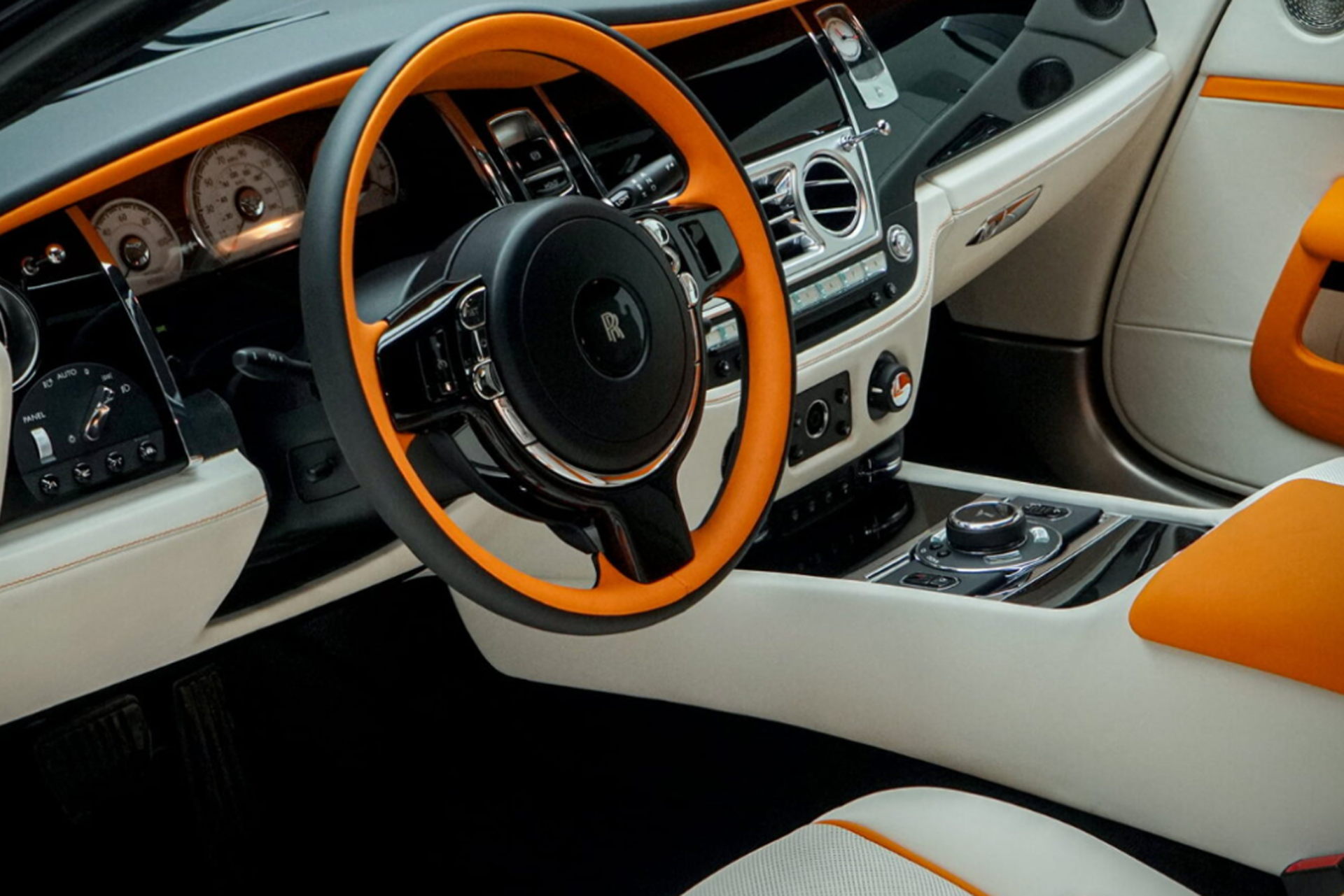 Luxury car interior after professional detailing, showing clean leather seats, polished dashboard, and restored freshness